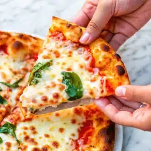 Easy Margherita Pizza fresh out of the oven with basil and golden crust