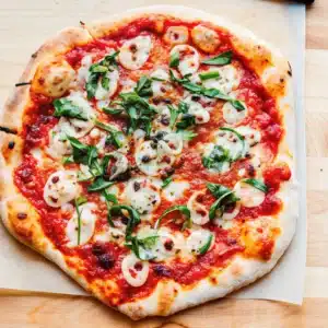 Homemade Margherita Pizza with bubbly mozzarella and basil
