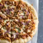 Step-by-step instructions for homemade BBQ chicken pizza with ingredients and directions