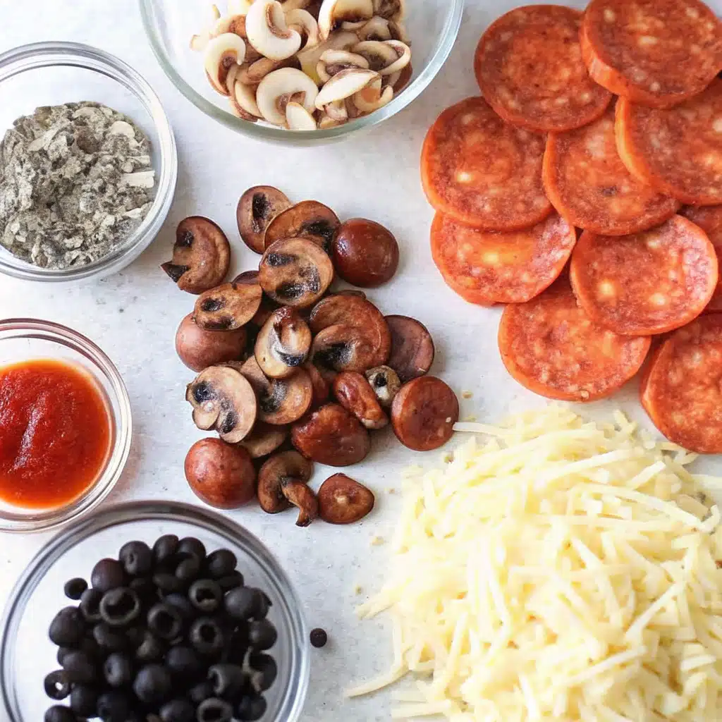 sheet-pan-pizza-ingredients Ingredients for homemade sheet pan pizza laid out on a table